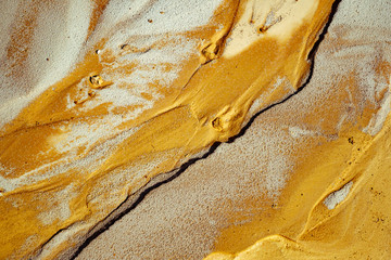 Abstract golden sand texture on the beach, top view