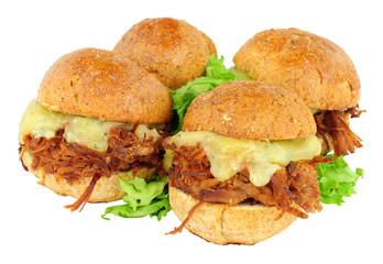 Group of small shredded beef sandwich sliders with melted cheese isolated on a white background