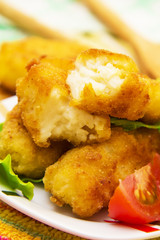 Plate of croquettes with lettuce and tomato