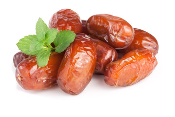 Dates with mint leaves isolated on white background