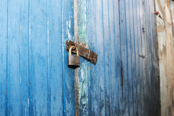 Closeup of old wooden door with metal lock