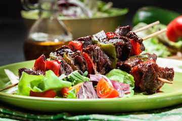 Grilled beef meat and vegetable kebabs