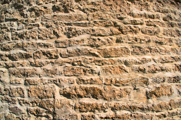 Texture of an ancient medieval limestone wall of the castle