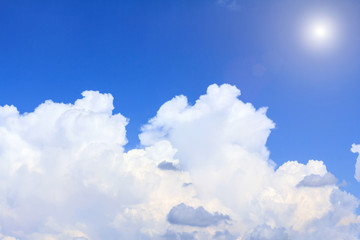 Naklejka na ściany i meble Blue sky background with white clouds rain clouds and sunshine on sunny summer or spring day.