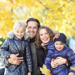 Family with children in autumn park