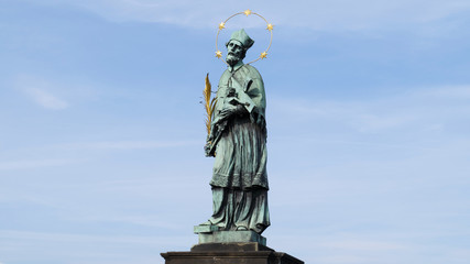 Statue of St. John of Nepomuk on the Charles Bridge in Prague, Czech Republic