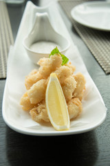 fried squid rings breaded with lemon