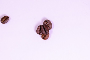 Pile of the roasted coffee beans isolated on white. Top view