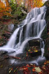 Fototapeta na wymiar Beautiful waterfall in forest
