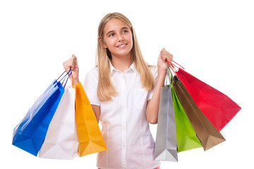 Fototapeta na wymiar shopping, sale, christmas and holiday-happy teenage girl with shopping bags looking up, isolated