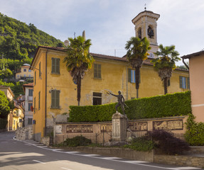Fototapeta na wymiar The village center of Maccagno on Lake Maggiore with a war memorial - Maccagno, Lake Maggiore, Varese, Lombardy, Italy