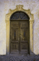 Fototapeta na wymiar Old house door in Maccagno on Lake Maggiore - Maccagno, Lake Maggiore, Varese, Lombardy, Italy