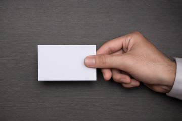 Mockup of white business cards in man's hand