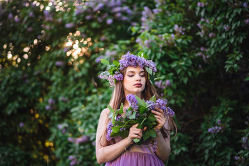 The girl with the wreath on his head in lilac
