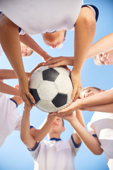Junior Football Team Holding Ball