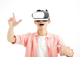 Excited young man with VR headset 