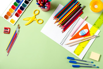 Back to school concept. School supplies on a pastel background