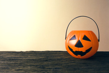 halloween pumpkin pot on wood table