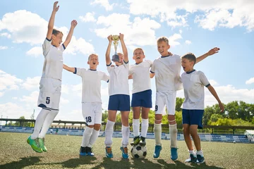 Foto op Canvas Junior Football Team Celebrating Victory © Seventyfour