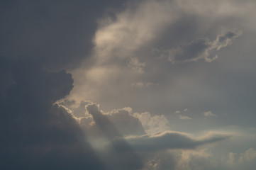 gloomy sky with sunrays