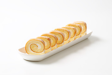 Slices of cream Swiss roll