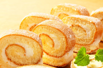 Slices of cream Swiss roll