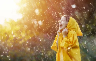 Fotobehang child under autumn rain © Konstantin Yuganov