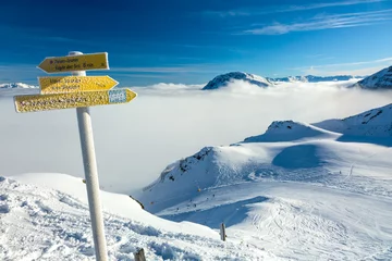 Foto op Canvas Road Sign on the Ski Piste in Austrian Alps © alexbrylovhk