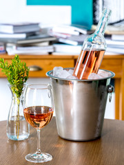 Wine glass and wine bottle on the table