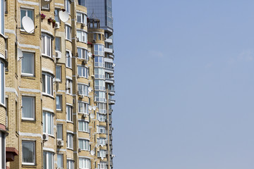 Multi-storey apartment on a background of blue sky