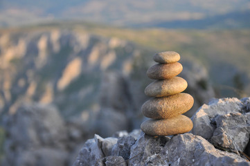 Balanced stone pyramid on mountain. Zen rock, concept of balance and harmony