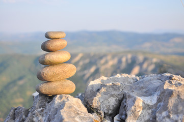 Balanced stone pyramid on mountain. Zen rock, concept of balance and harmony