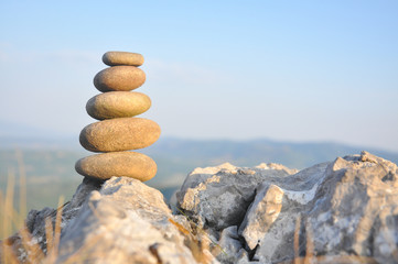 Balanced stone pyramid on mountain. Zen rock, concept of balance and harmony