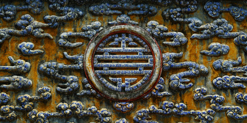 detail of temple with circular design of symbol of prosperity, luck, longevity