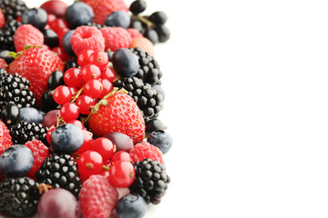 Ripe and sweet berries on white background