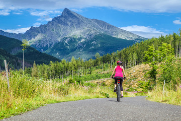 Woman on bike enjoy beautiful nature
