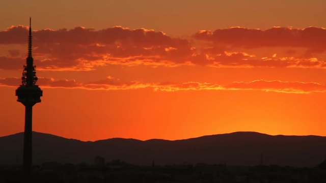 Silhouette of television tower El Pirul in Madrid at sunset, Timelapse