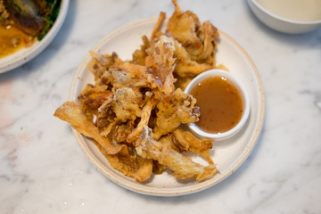 Different crispy fried mushrooms with sweet sauce