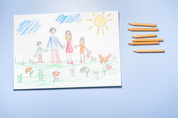 Children's drawing and color pencils top view