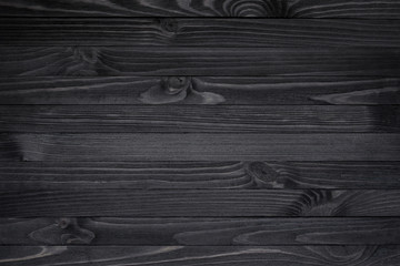 Dark black wood texture background viewed from above. The wooden planks are stacked horizontally - obrazy, fototapety, plakaty