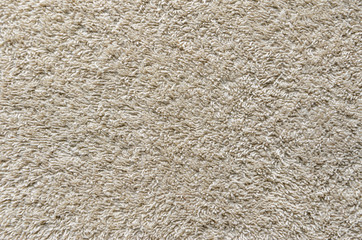 Beige Towel Texture Background. Texture of a beige towel or carpet