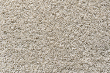 Beige Towel Texture Background. Texture of a beige towel or carpet