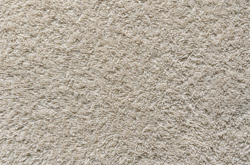 Beige Towel Texture Background. Texture of a beige towel or carpet