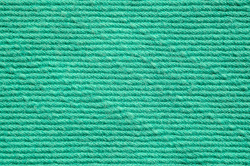 Green Denim Textile Texture Close-up. Macro Snapshot of Tissue Structure
