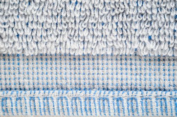 Macro shot of a white towel. Geometric pattern of villi on fabric material. Towels edge finishing element