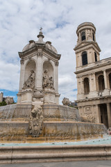 Fototapeta na wymiar Paris, place Saint-Sulpice, the fountain and the church 