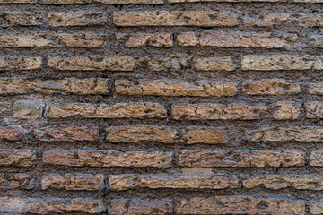 Ancient old grunge red brick wall texture as background