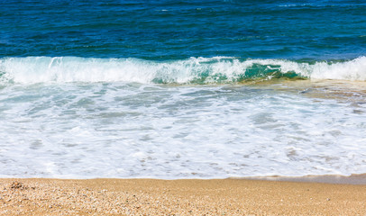 Sandy beach and blue sea background