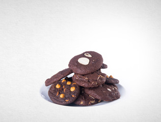 Cookies or Almonds chocolate cookies on background.