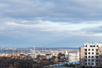 Fototapeta na wymiar City view with cloudy sky.